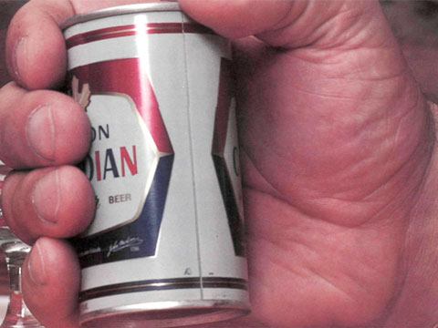 Andre the Giant's massive hands around a can of beer