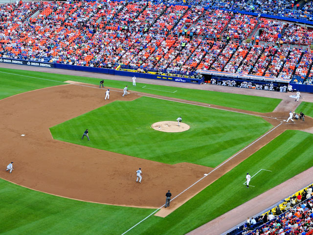 Baseball players playing their position on defense