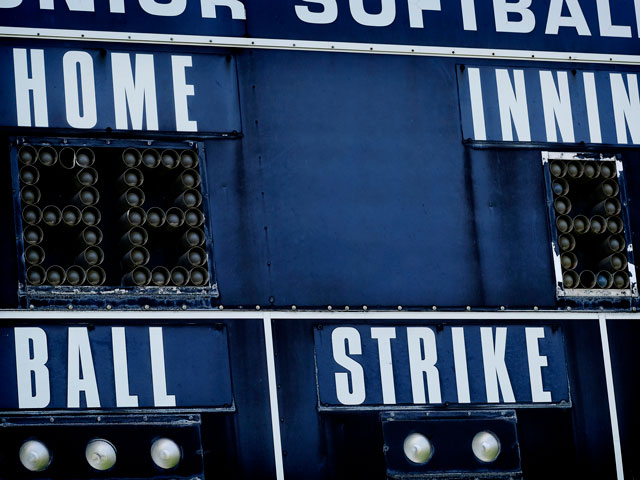 The electronic scoreboard keeps track of innings so the crowd can know what's going on in the game.