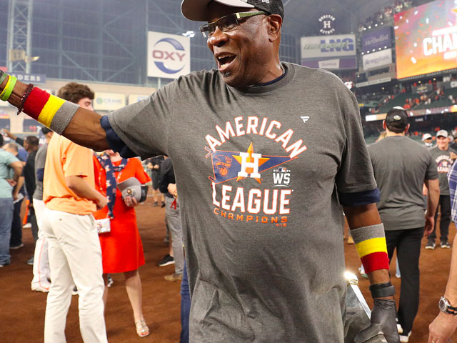 Dusty Baker celebrating ALCS victory wearing a gray batting glove